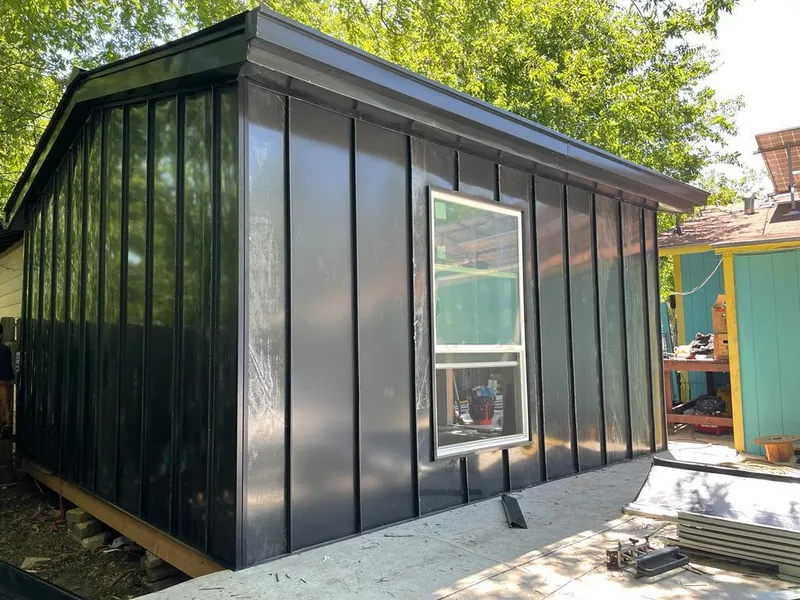 Black standing seam metal wall panels for Roof Inspection in Cave Springs