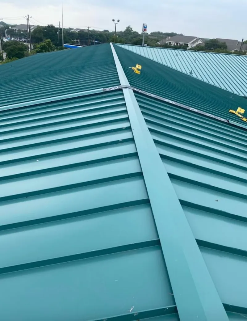 Green commercial metal roof ridge and valley for Metal Roof Repair in Cave Springs